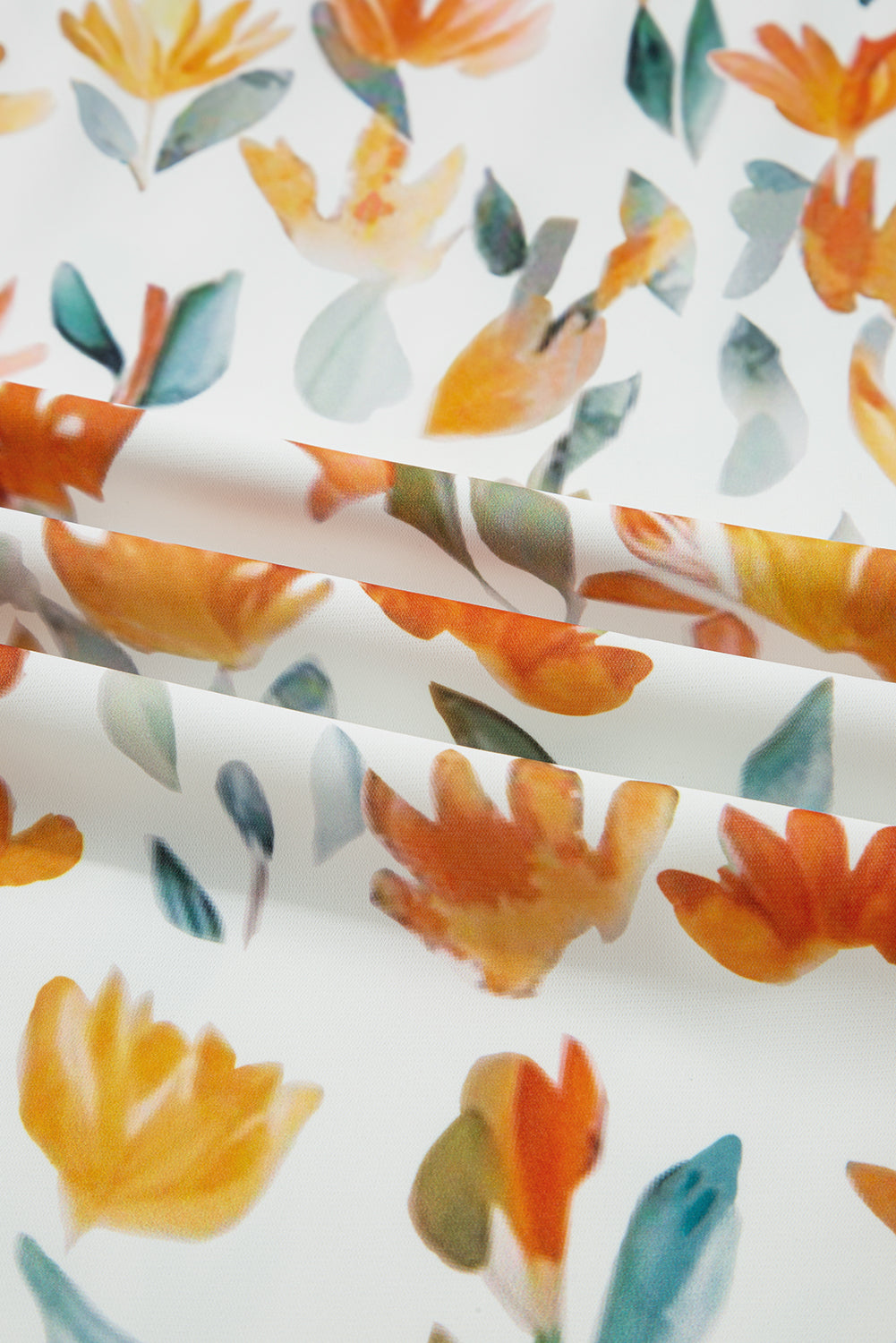 White fabric with watercolor orange flowers and green leaves, floral textile pattern