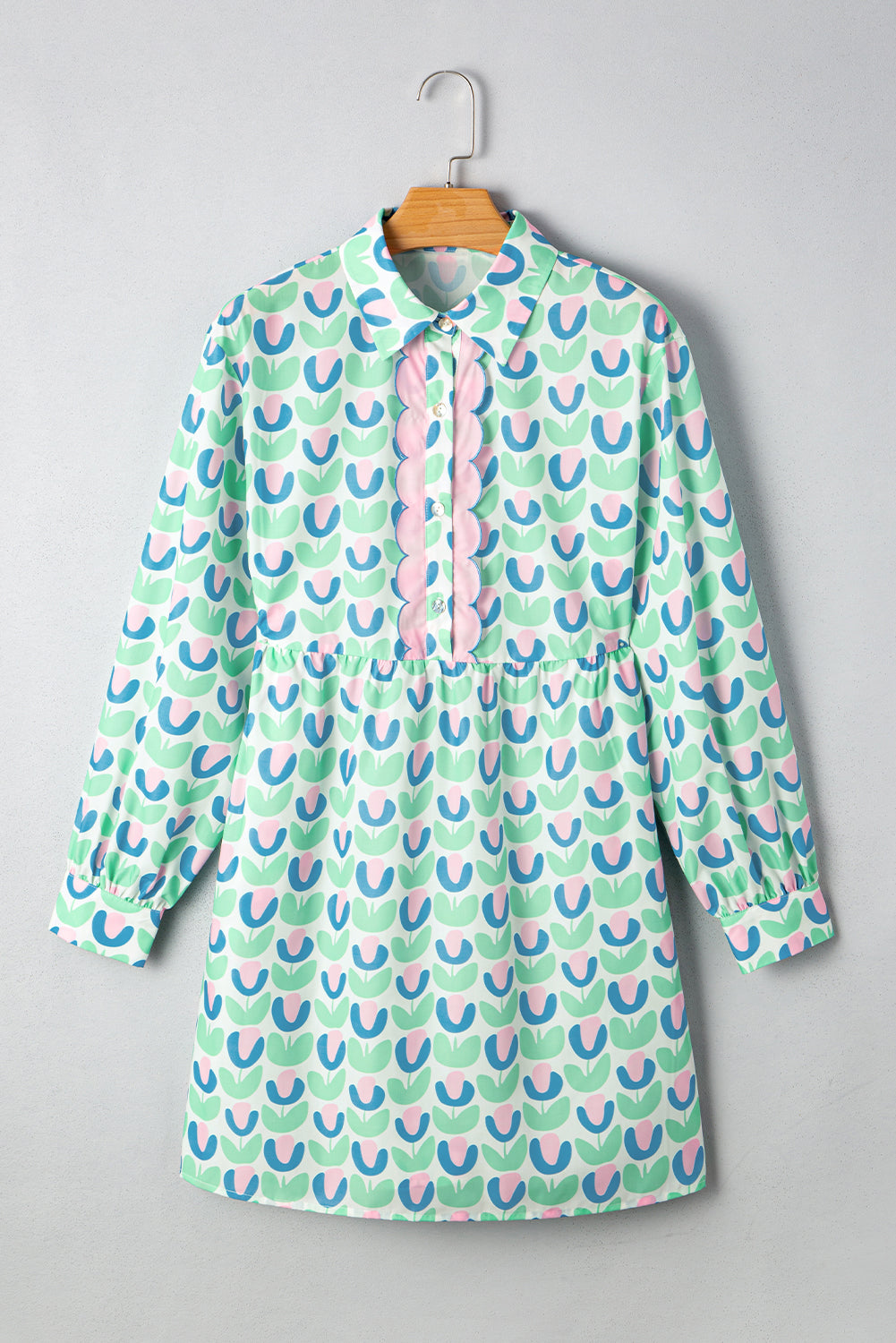 Mint green long sleeve dress with pink and blue tulip print, scalloped front placket