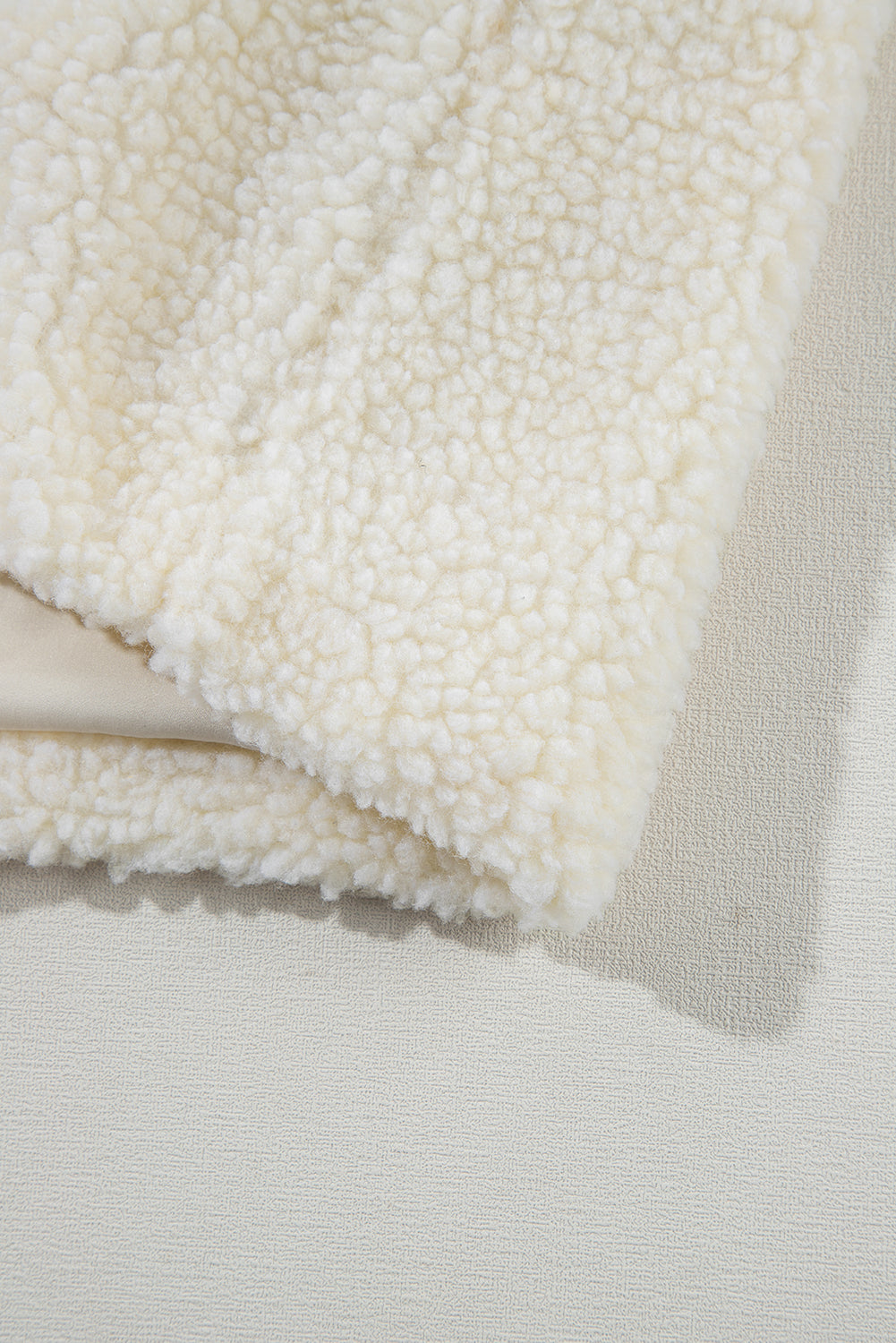 Fluffy light beige jacket with hood 