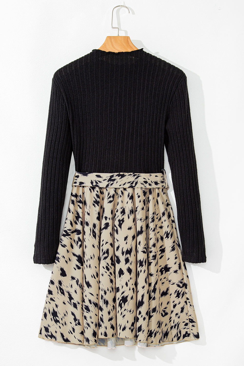 Long sleeve black ribbed knit top dress with pleated beige and black animal print skirt