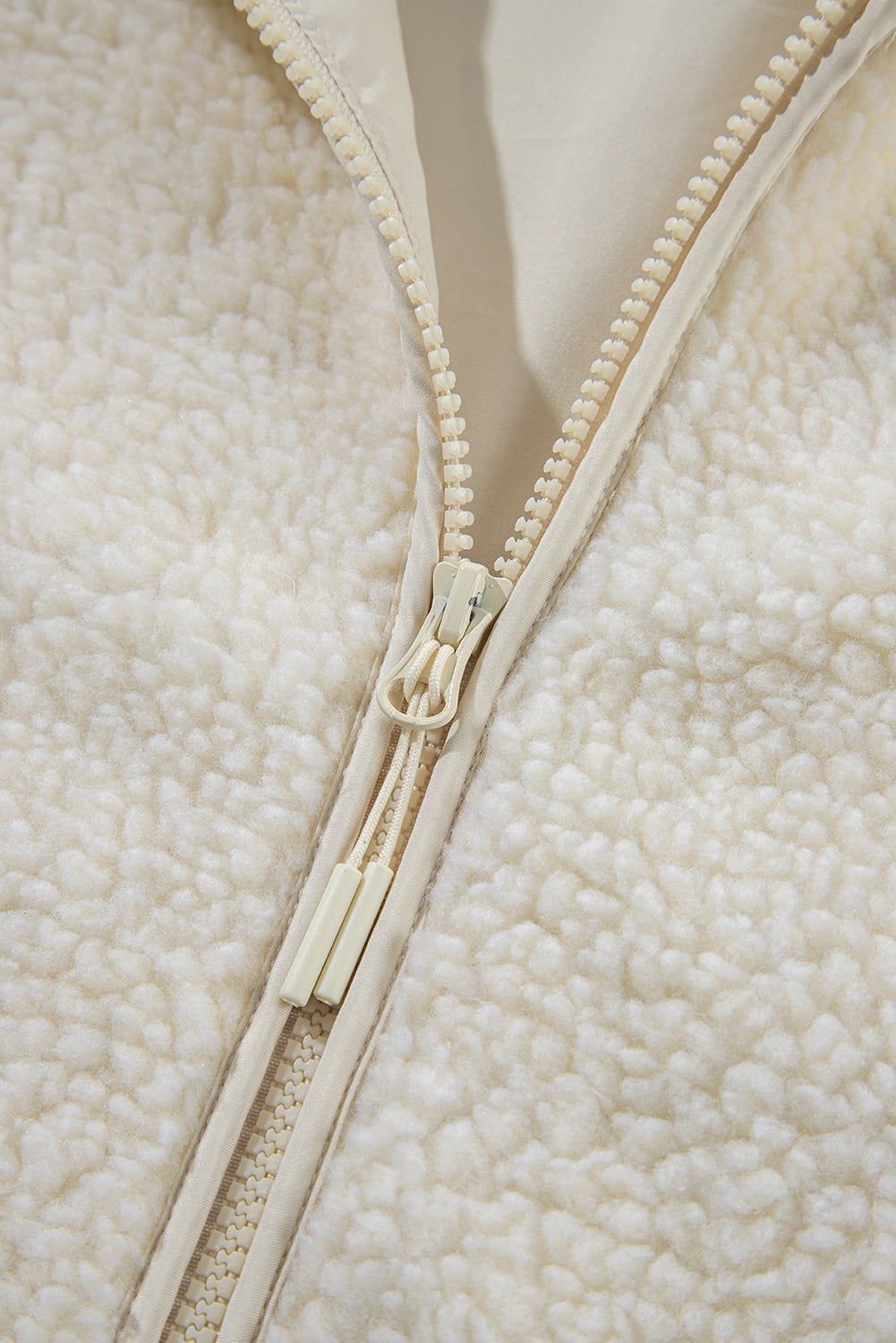 Fluffy light beige jacket with hood 