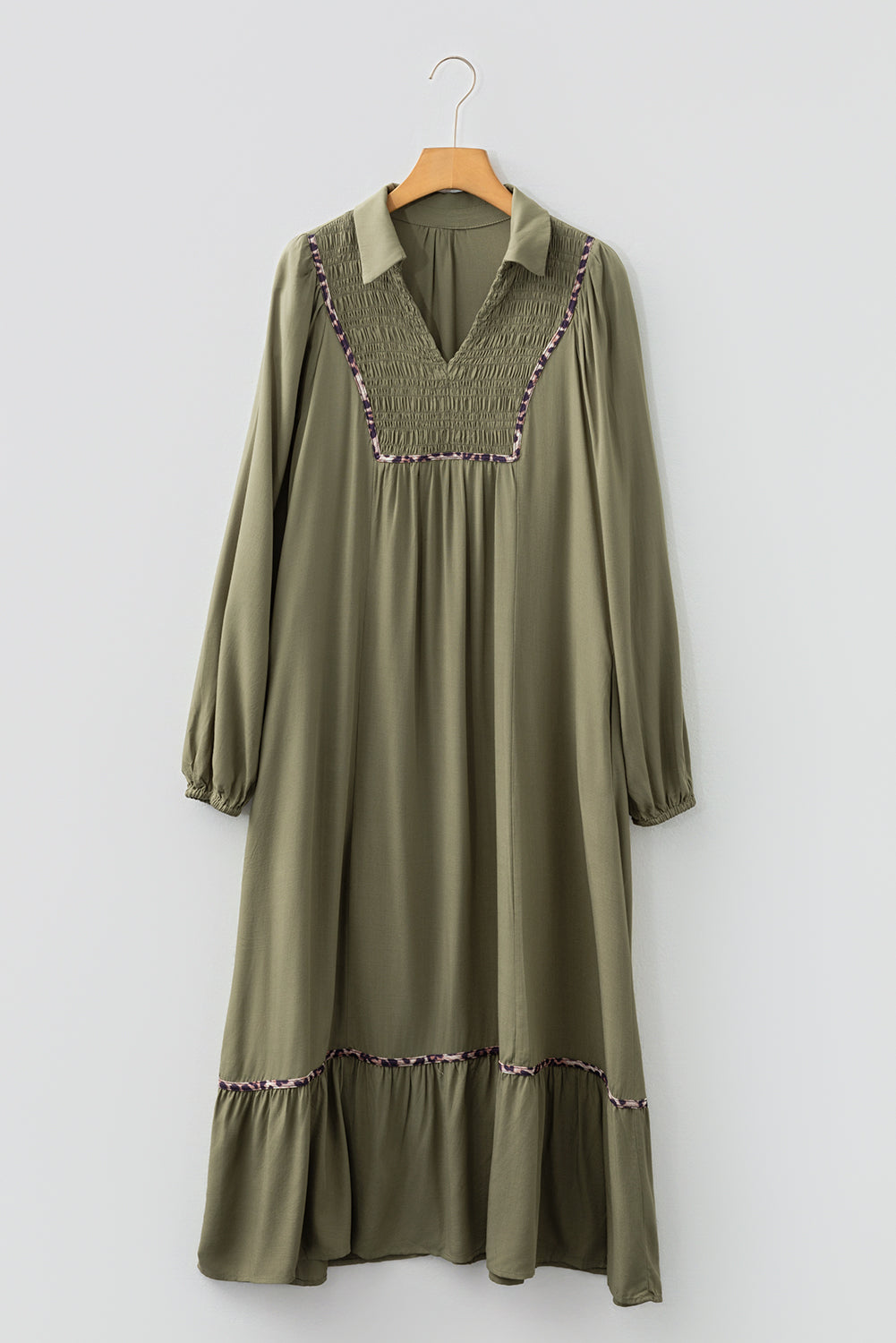Olive green long sleeve midi dress with smocked chest, collar, and ruffle hem accents