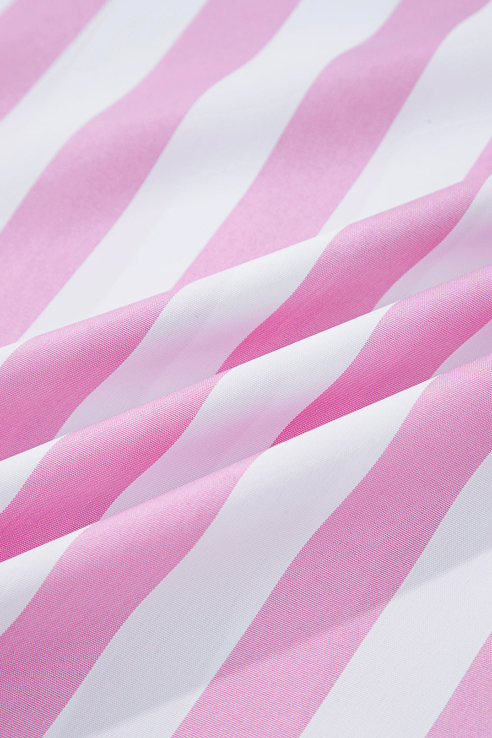 Close-up of pink and white striped fabric, soft textile pattern