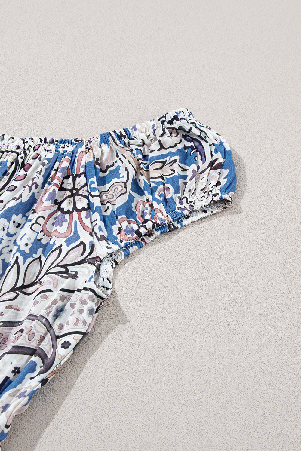 Blue and white floral off-shoulder blouse with ruched elastic sleeve detail