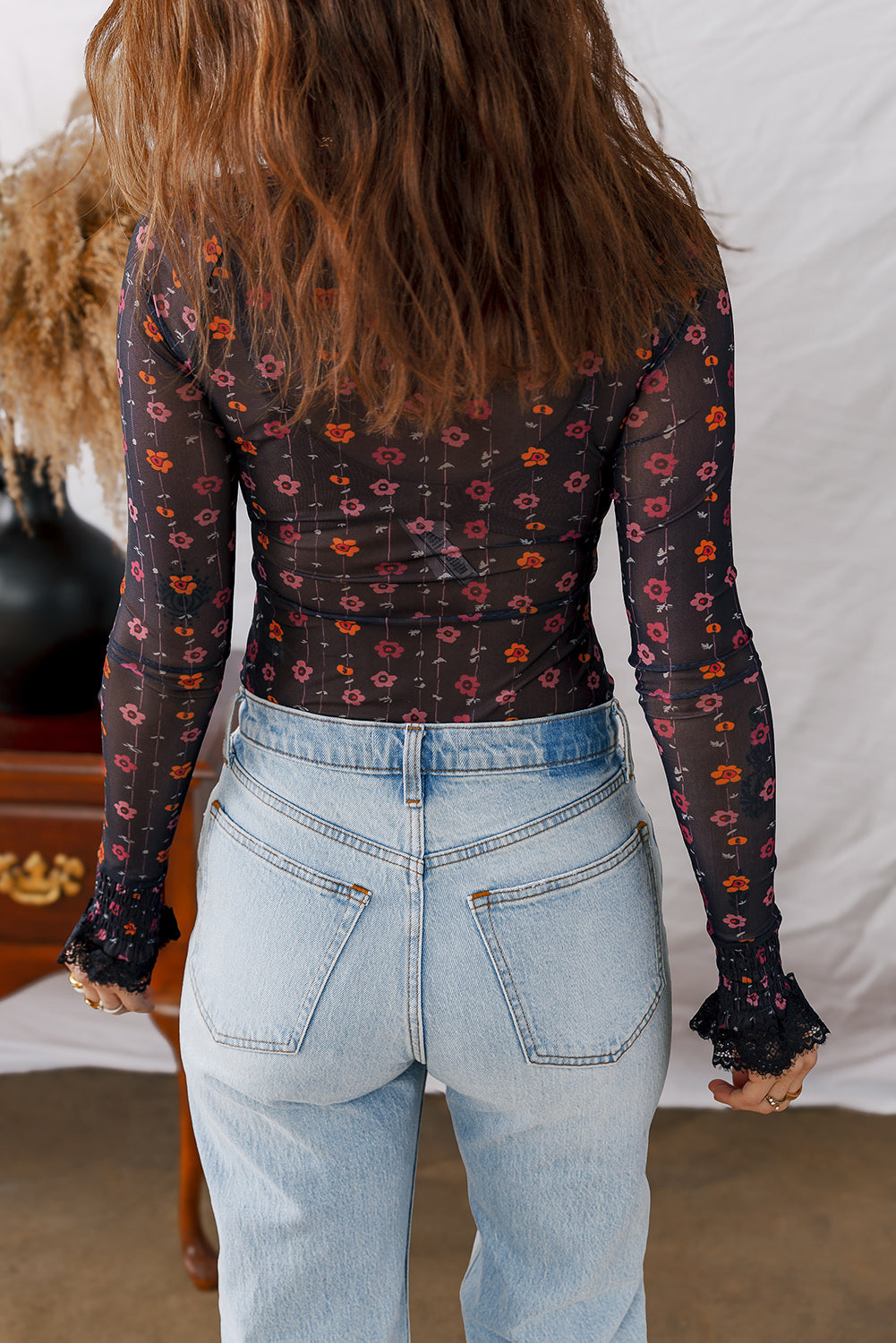 Mesh bodysuit with floral print 