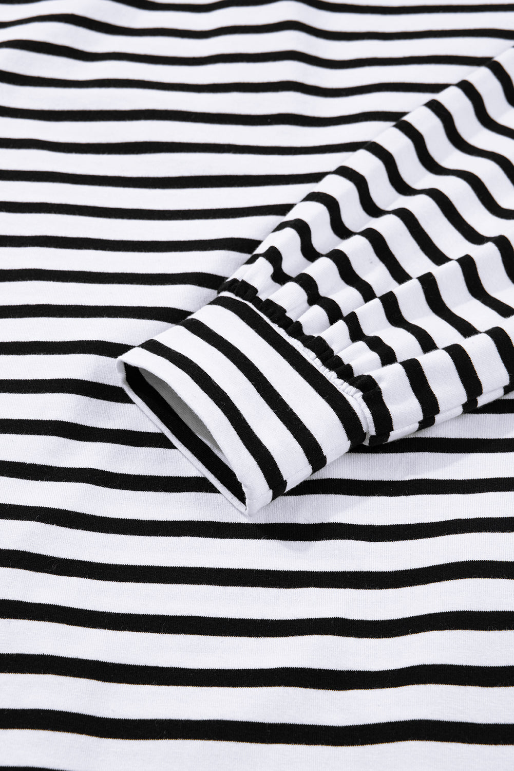 Black and white striped long sleeve shirt cotton fabric close-up