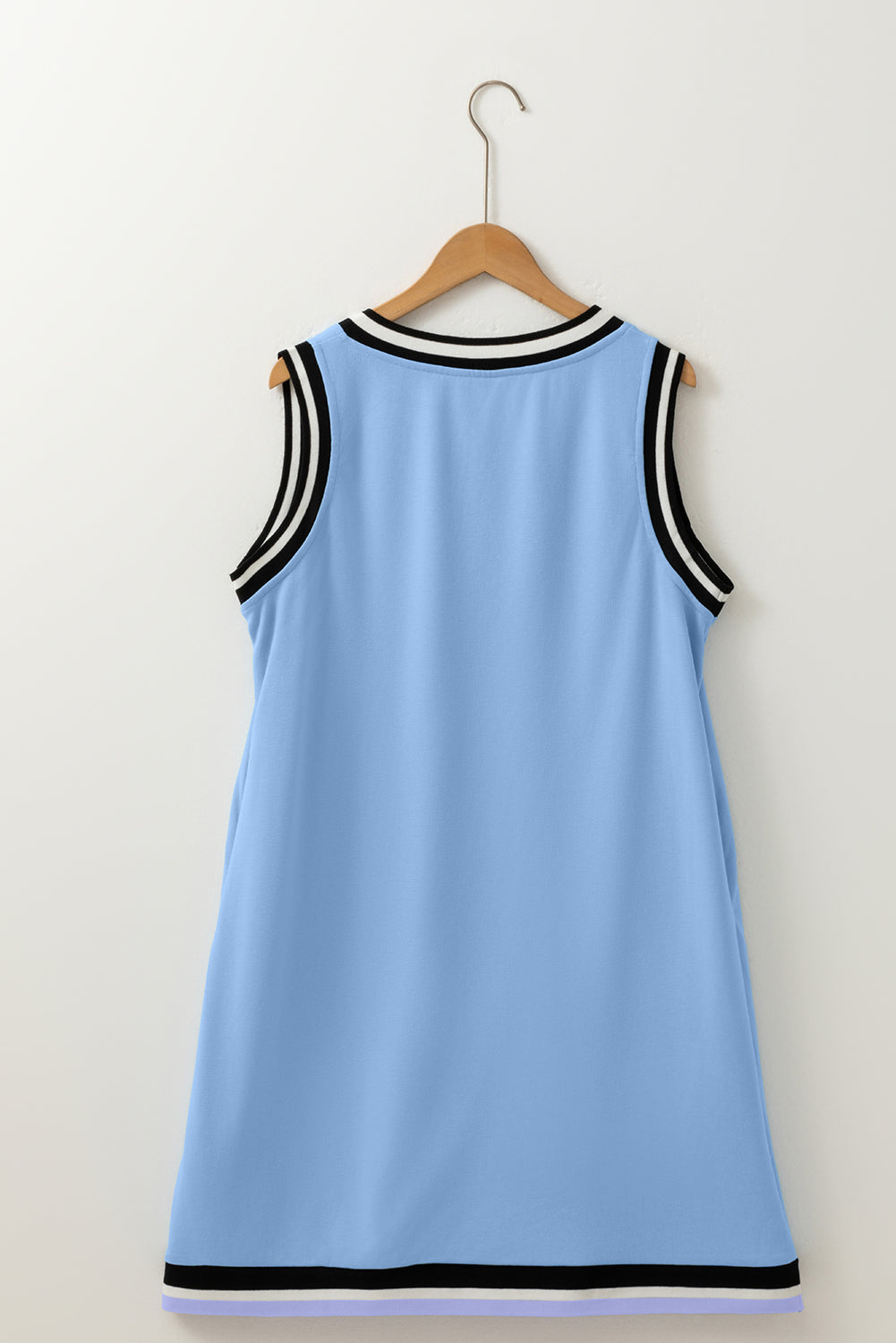 Sleeveless light blue dress with black and white striped trim on collar and armholes, back view