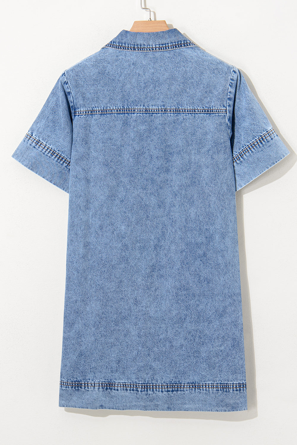 Back view of short sleeve light blue denim shirt with contrast stitching