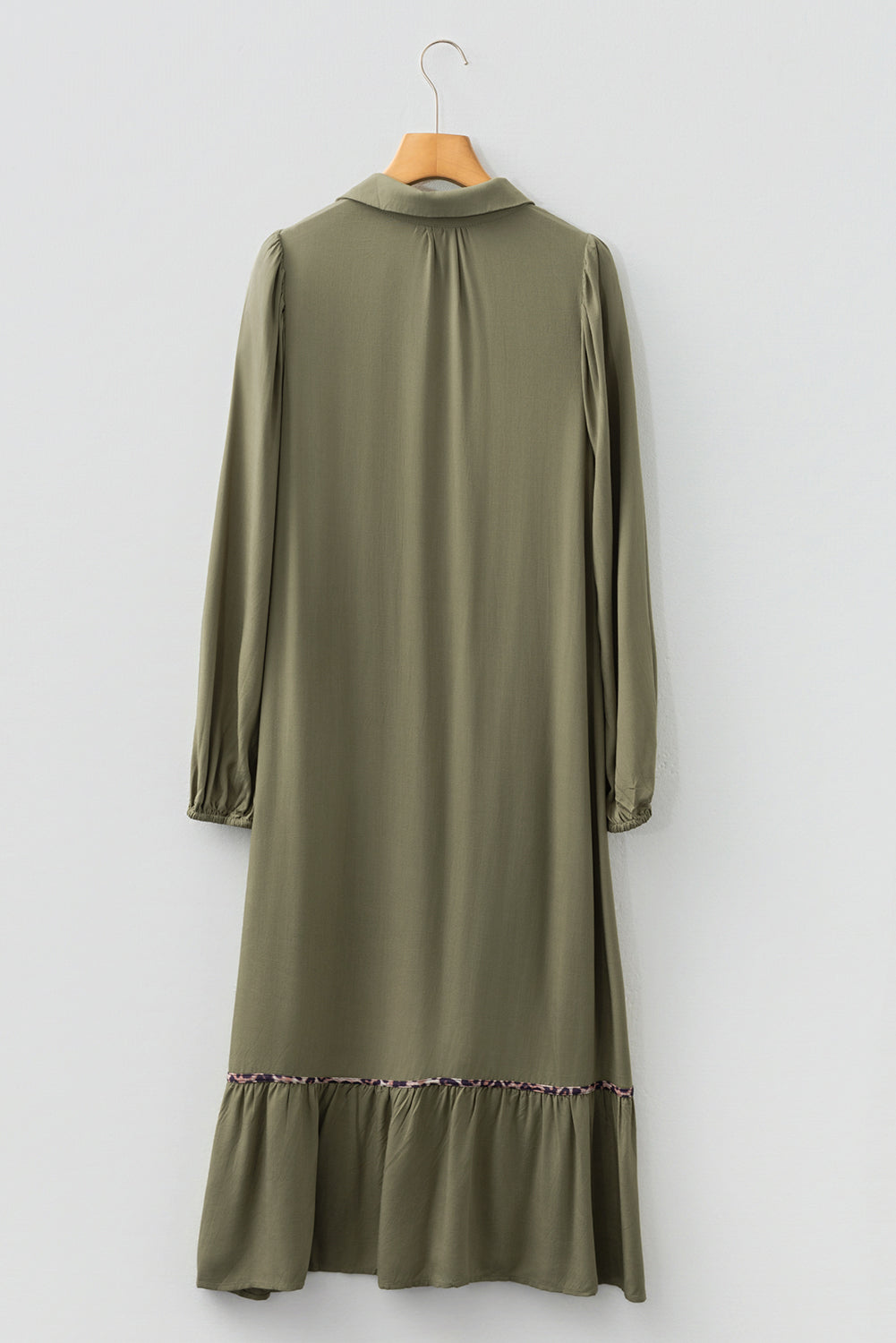 Back view of long sleeve olive green midi dress with ruffle hem and collar, on hanger
