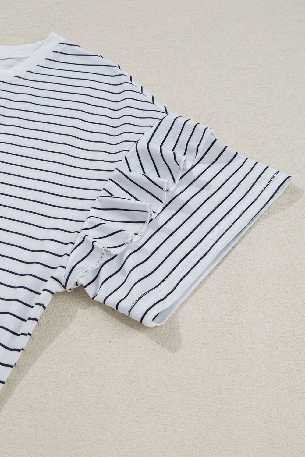 White and black striped short sleeve t-shirt with ruffle detail on sleeve