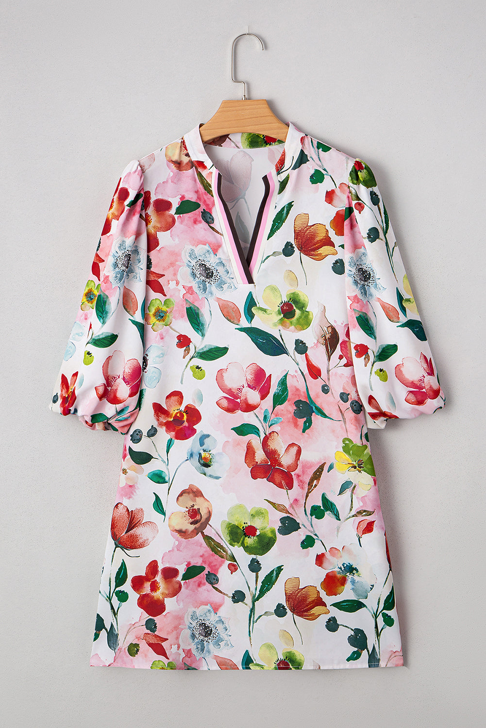 Floral print dress with V-neck and puff sleeves, vibrant multicolor flowers on white fabric