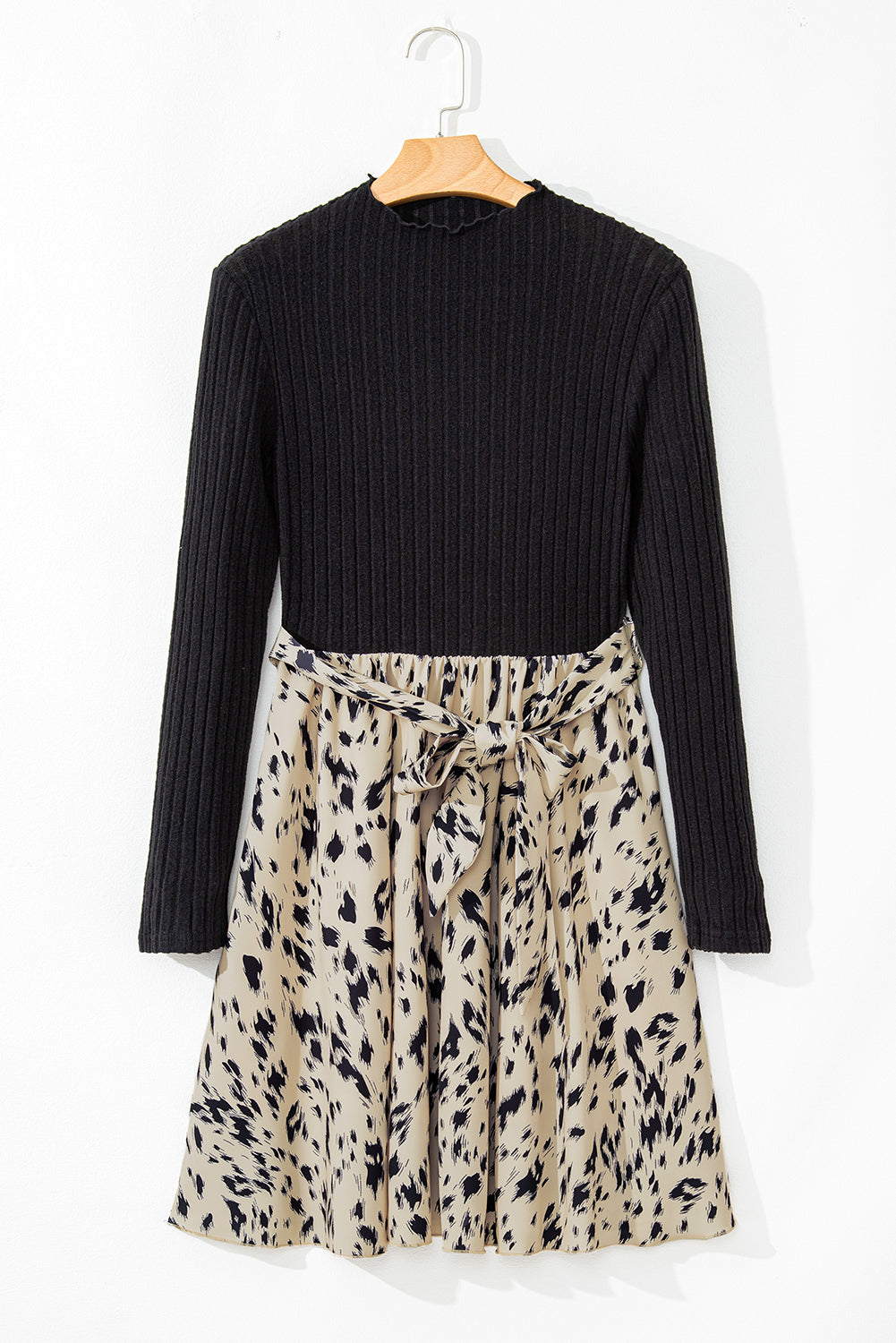 Women’s long sleeve black ribbed dress with beige leopard print skirt and waist tie