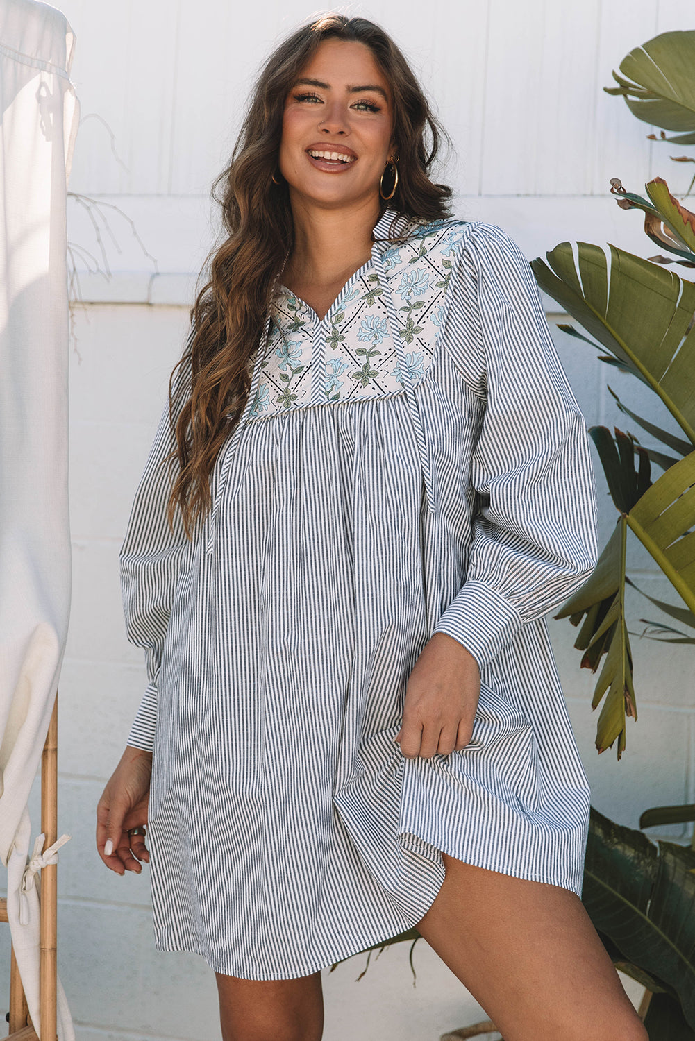 Striped dress with floral details 