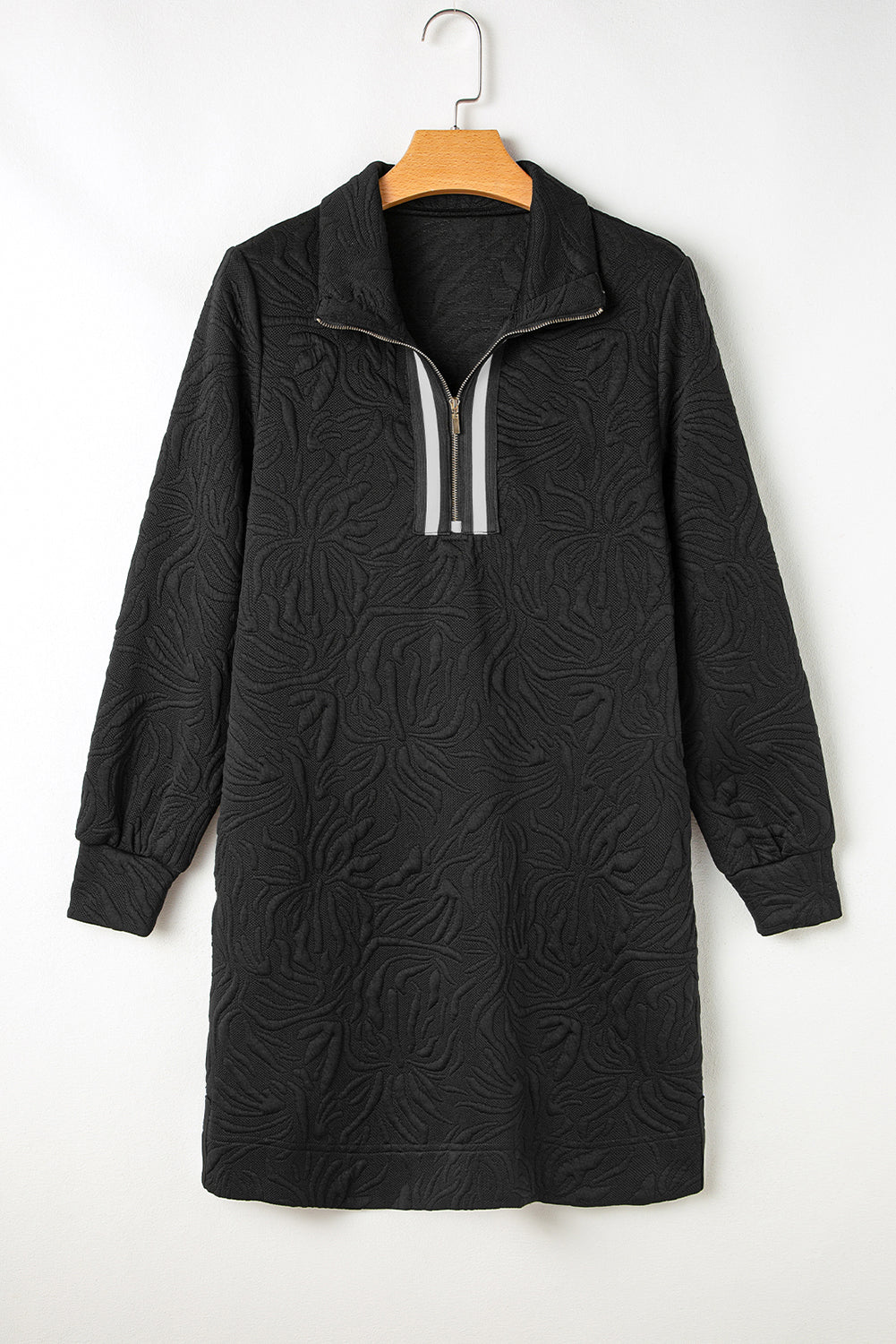 Black textured long sleeve dress with zip collar and floral embossed pattern