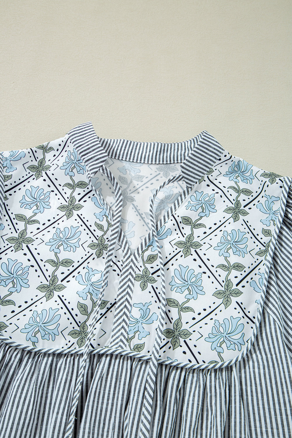 Striped dress with floral details 