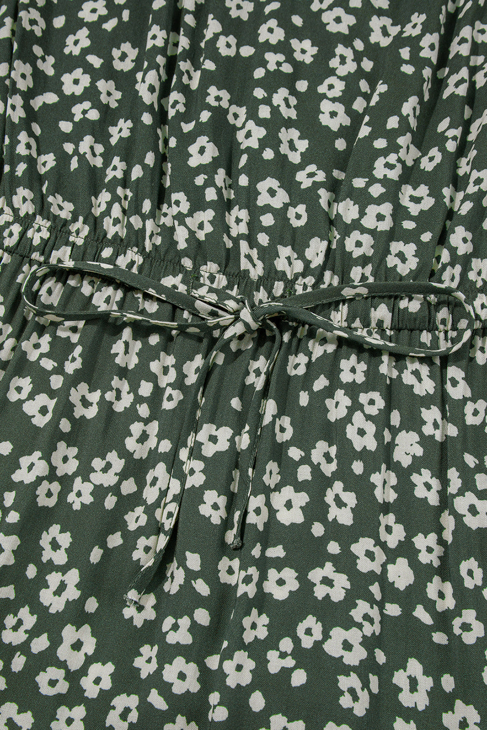 Green floral dress with white flower print and fabric waist tie detail